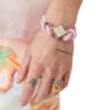 Bracciale con perle annodate rosa Bracciale con perle annodate rosa