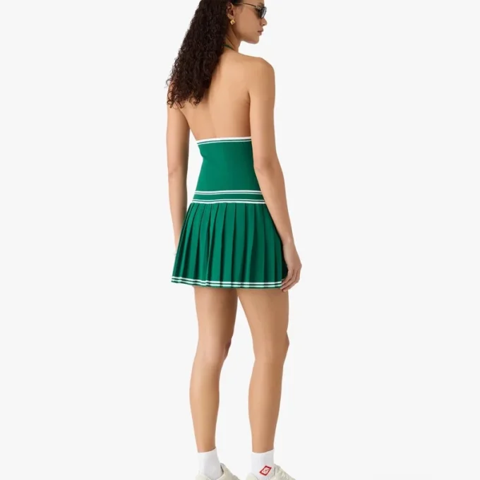 Miniabito verde plissettato con scollo all’americana