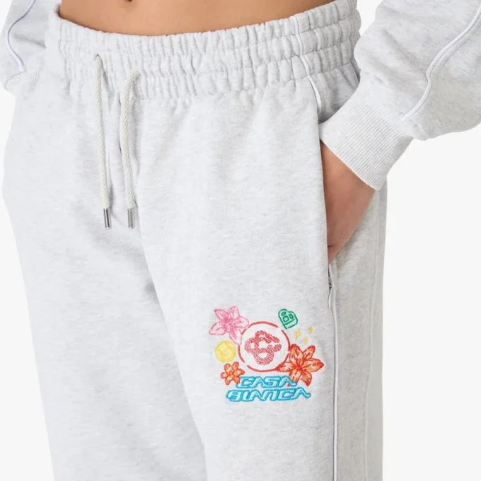 Pantaloni da tuta corti grigi ricamati