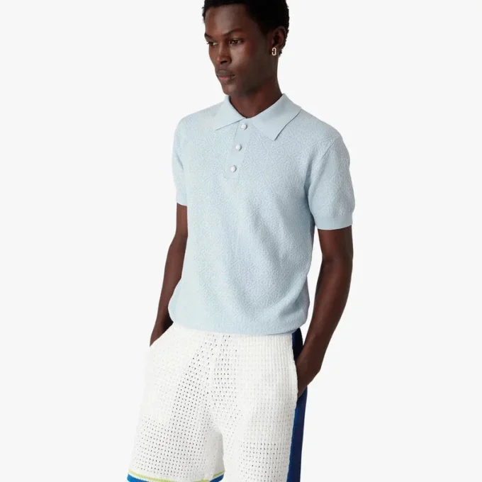 Polo a maniche corte con monogramma blu a punto traforato in pantaloncini