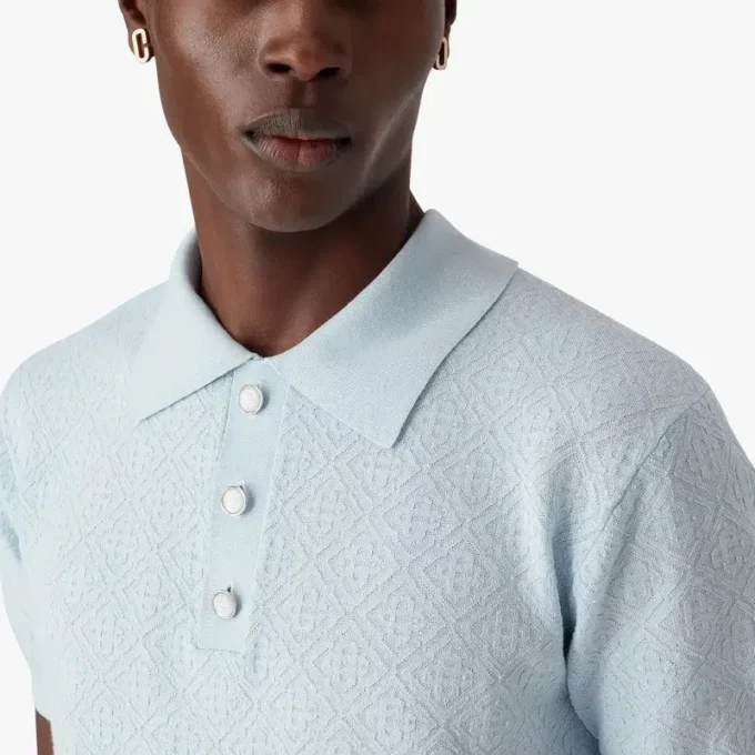 Polo a maniche corte con monogramma blu a punto traforato in pantaloncini