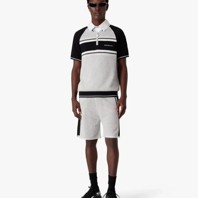 Polo a pantaloncini con zip e strisce in rete metallica