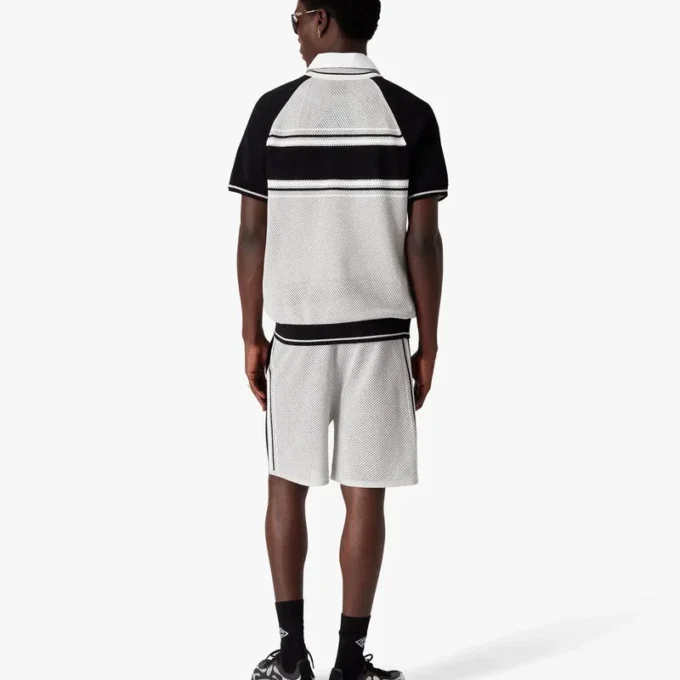 Polo a pantaloncini con zip e strisce in rete metallica