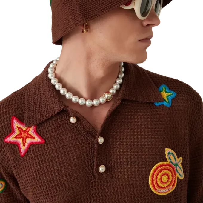 Polo con motivi all’uncinetto