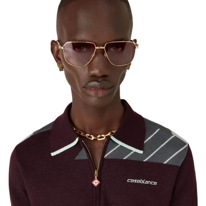 Polo da tennis in lana merino a righe diagonali