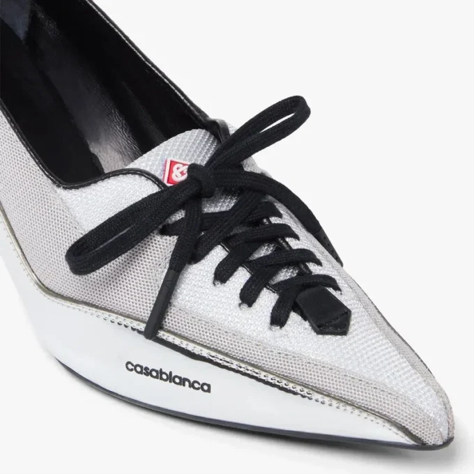 Sneaker con tacco in pelle argentata Sneaker con tacco in pelle argentata