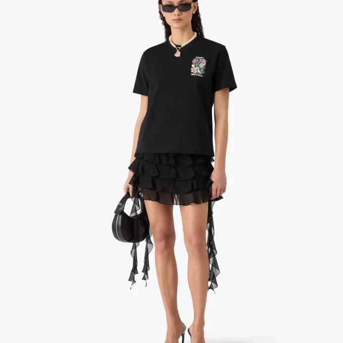 T-shirt a maniche corte con graffiti neri